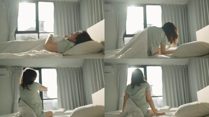女人在卧室里伸展身体的后视图