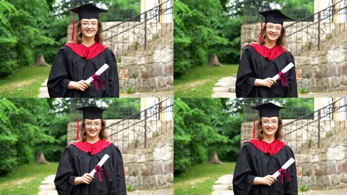 一个漂亮的微笑毕业的学生女孩的肖像，穿着黑色的学位服，拿着文凭。庆祝毕业典礼。