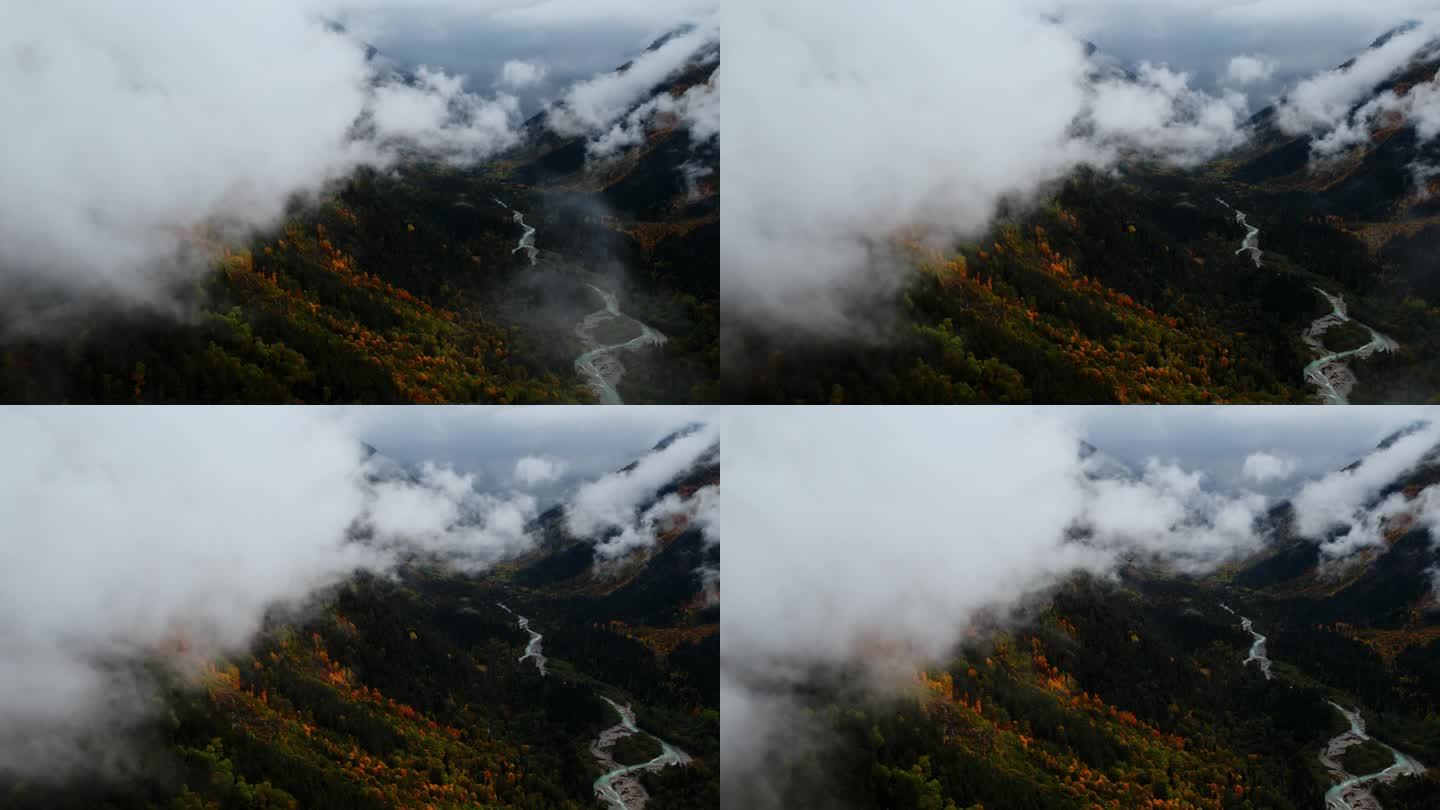 美丽的空中全景高山和山谷在多云的天气，相机飞越云层
