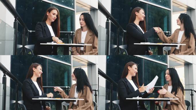 成功的商业女性伴侣在咖啡馆的露台上远程工作。在一家露天餐厅参加商务会议的女商人正在讨论一个项目。