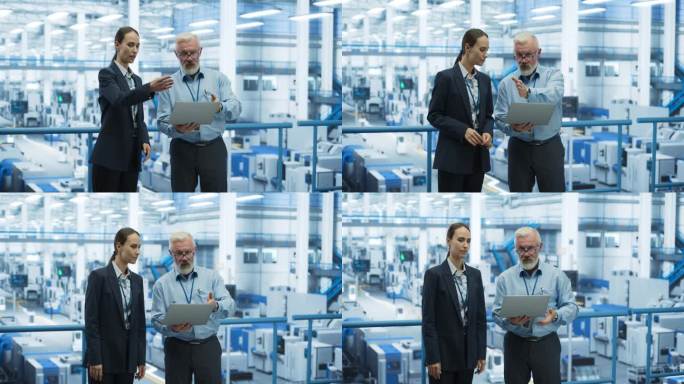 两个不同的工程师站在一个电子工厂的平台上，使用笔记本电脑。机器在生产电子元件，专家在监控在线软件的进