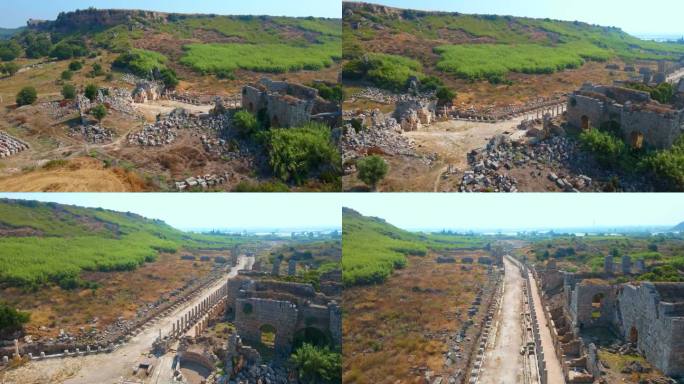 在这个迷人的空中库存视频中，展示了土耳其安塔利亚当代城市佩尔热古城的非凡废墟。相机优雅地在上方滑行，