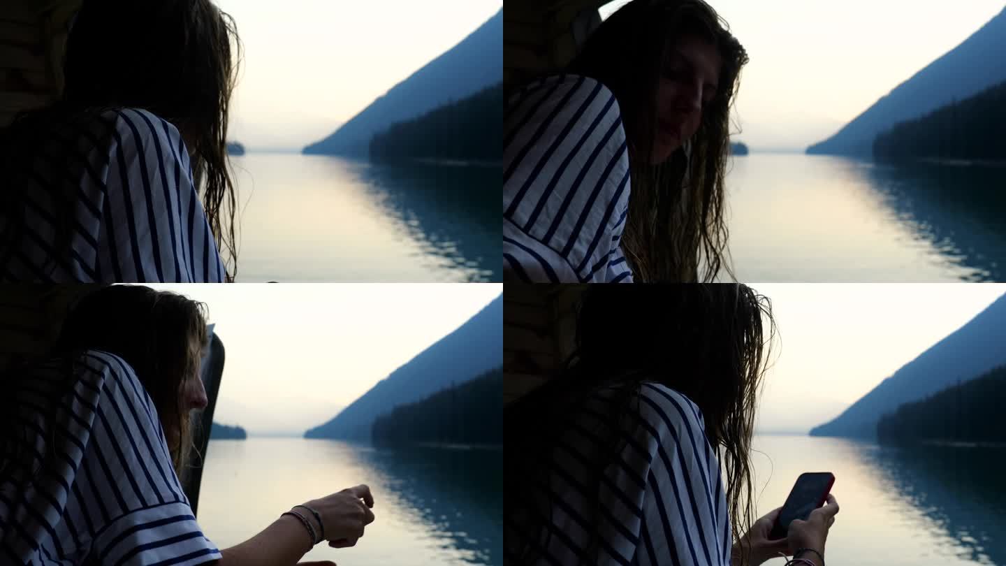 年轻女子在山间湖拍照