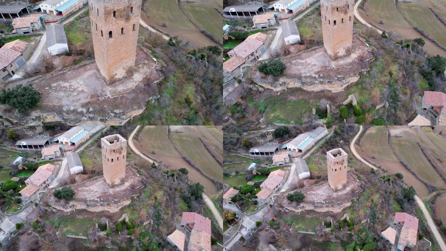 全景无人机视图的旧中世纪防御塔建于Reconquista的高度和周围地区的景观古代建筑的例子。西班牙