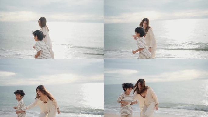 周末，快乐的亚洲母亲和孩子在海滩上愉快地放松。