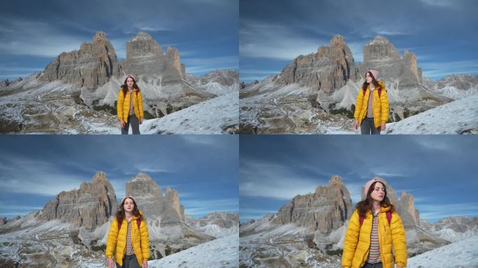 冬天在白雪覆盖的白云石徒步旅行的妇女