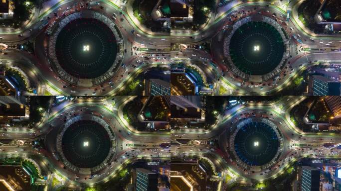 夜间照亮雅加达市中心著名的交通街道圈航拍全景4k延时印尼