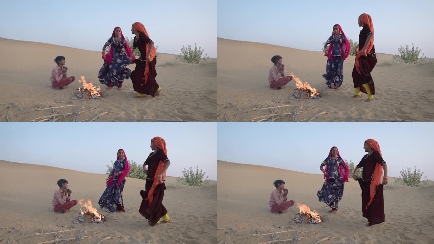 印度沙漠村庄，年轻的印度女孩在沙丘上跳舞