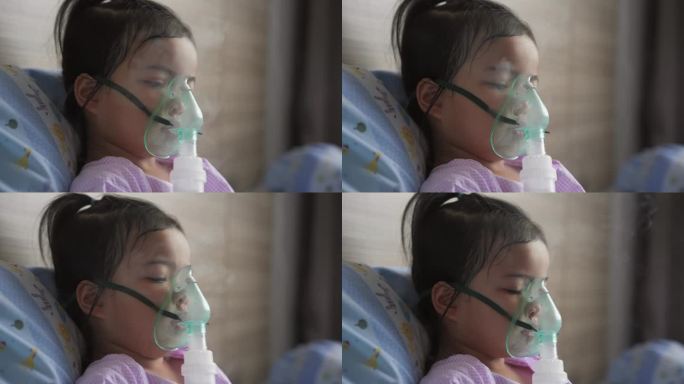 一个勇敢的亚洲小女孩正在用口罩呼吸