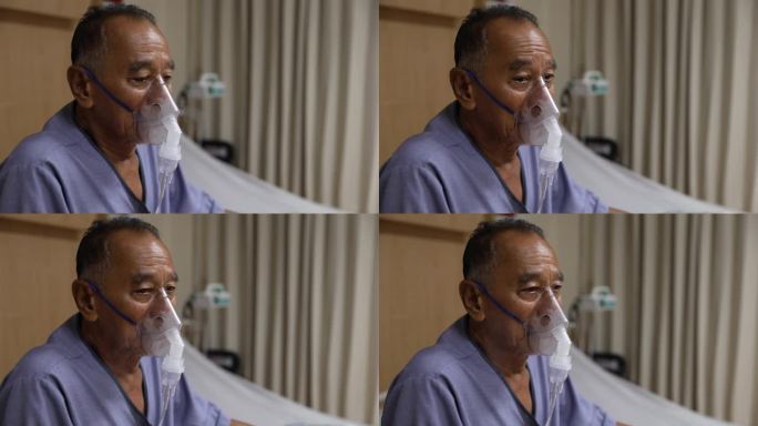 患病老人吸入治疗面罩式吸入器。男人有哮喘，需要喷雾器。病人男在医院使用雾化口罩吸入。高年级学生在喷支