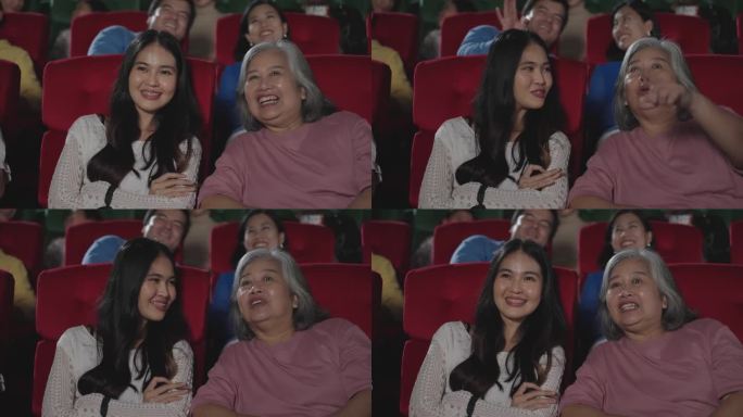 亚洲老年母女在电影院欣赏电影。在电影院看喜剧电影的快乐母女。娱乐和享受概念