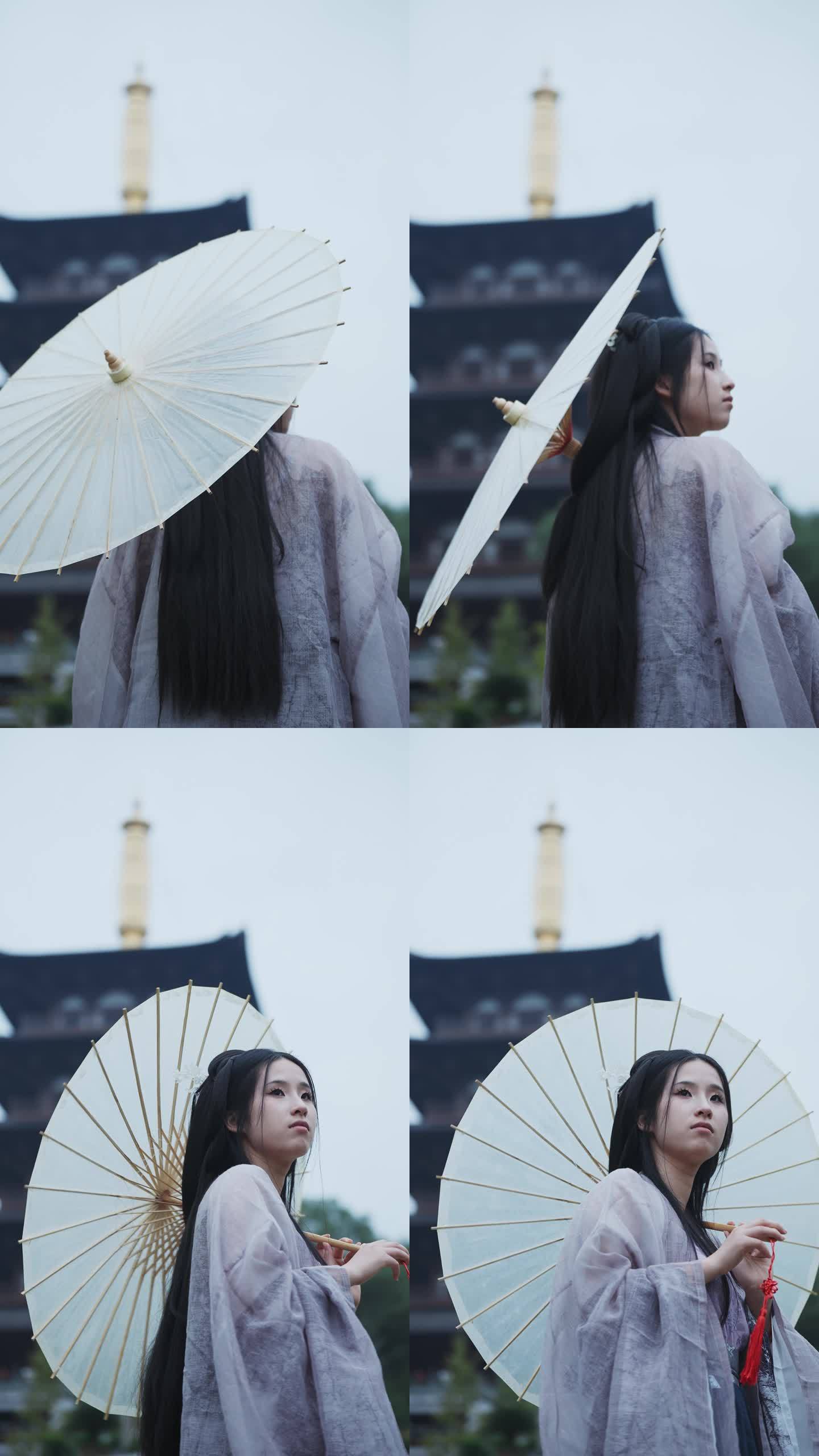 古代美女撑着油纸伞升格慢镜头