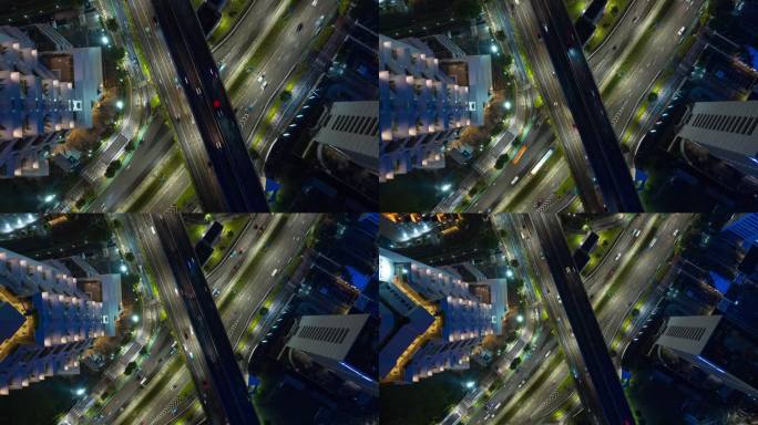 夜间照亮雅加达城市交通街道道路十字路口空中俯瞰全景4k延时印尼
