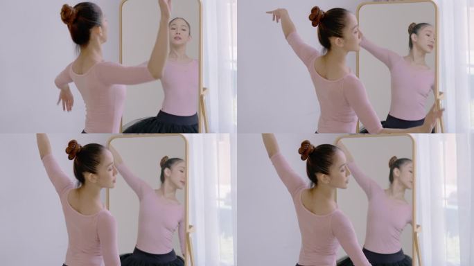 女人对着镜子跳芭蕾。