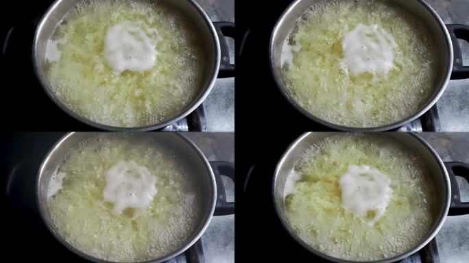 用奶酪做通心粉。Fusilli意大利面是在锅里的沸水里煮的。