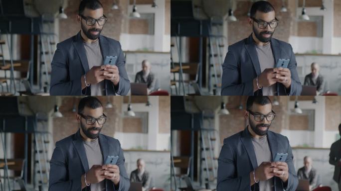一个野心勃勃的阿拉伯人站在咖啡馆里用智能手机上网聊天的慢镜头
