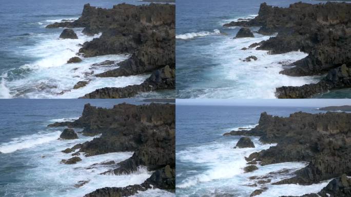 这是兰萨罗特岛火山岩海岸上海浪撞击和水花飞溅的特写镜头。稳固射击。