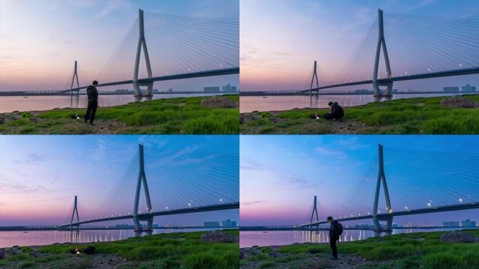 男子在武汉沌口长江大桥旁拍日转夜延时摄影