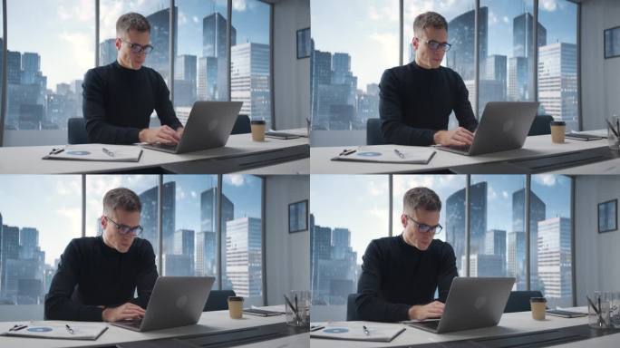 成功的白人商人在他的大城市角落办公室里用笔记本电脑工作的肖像。专业男性数字企业家为电子商务做数据分析