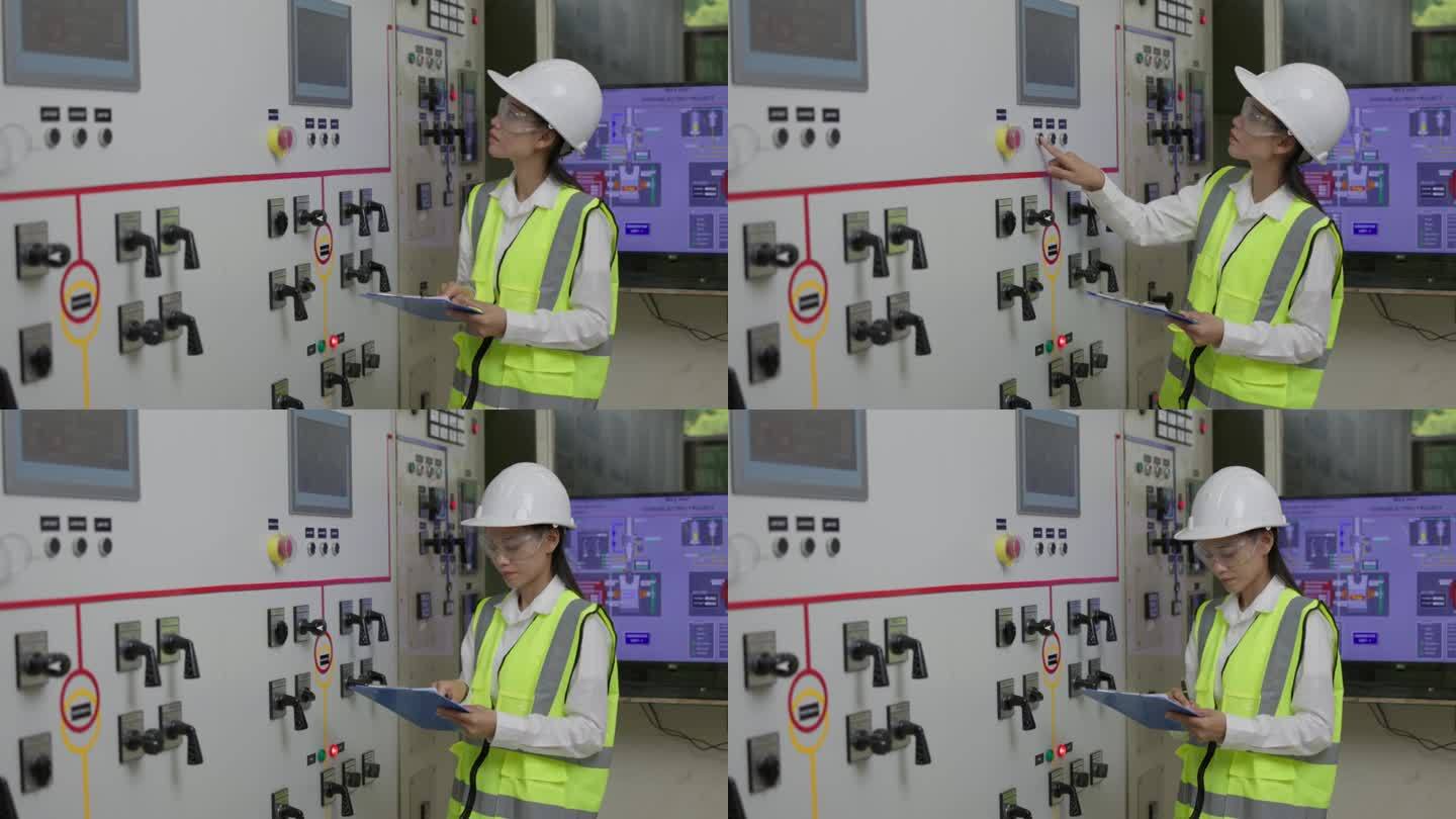 操作员电气工程师妇女在控制面板上的计量和填写报告，电气工程服务工人在控制用电量。