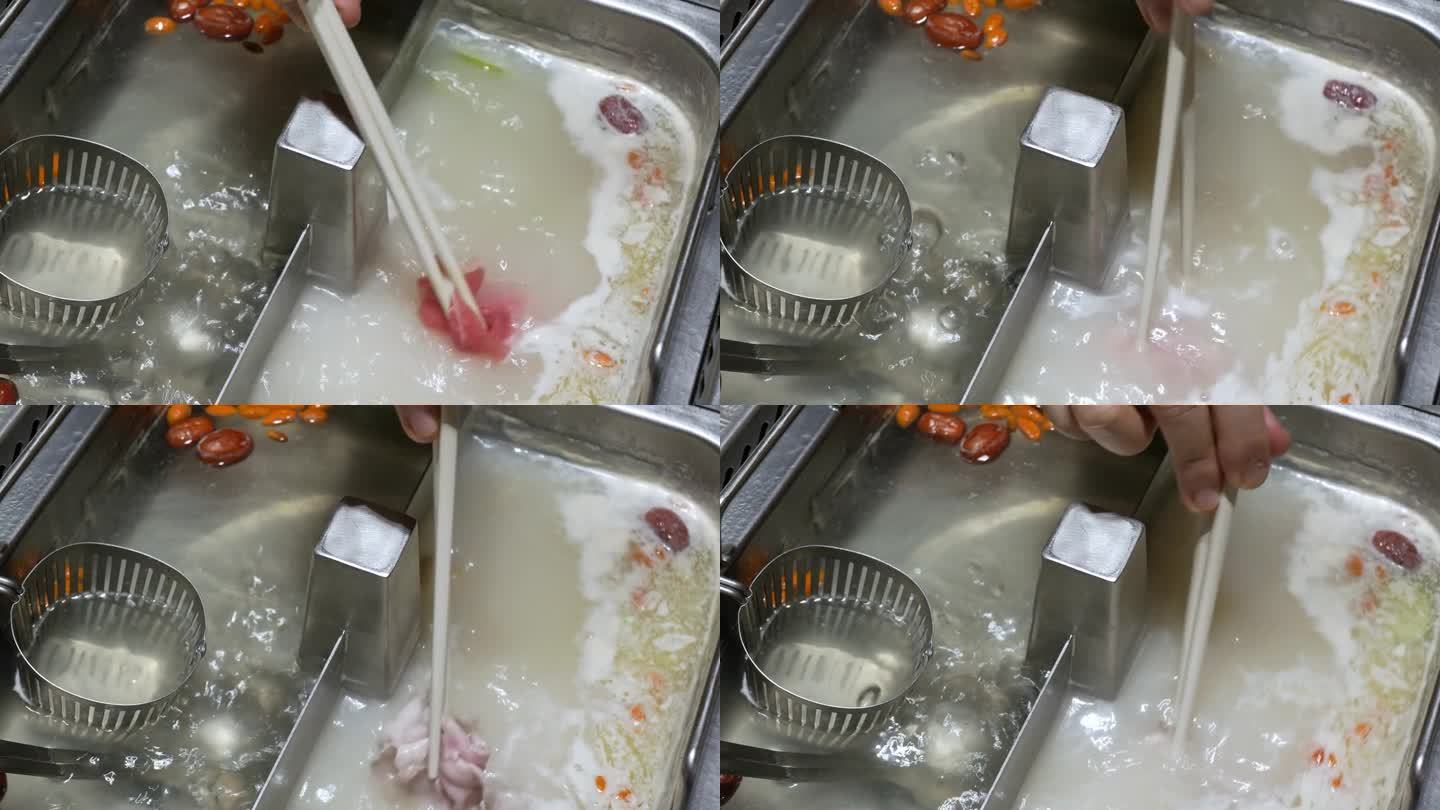 4k视频POV以火锅涮涮在中国四川风格，同时用筷子挑猪肉肉切片放入锅中与蔬菜。
