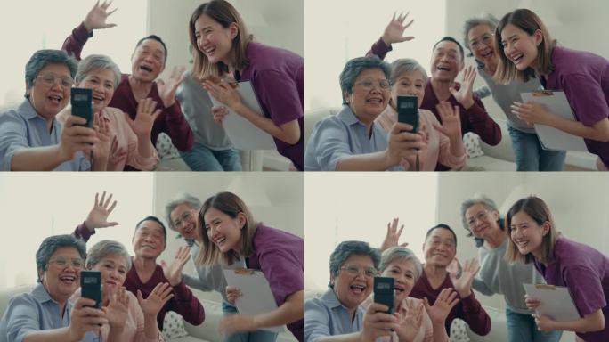微笑的亚洲老人在家里享受视频通话。