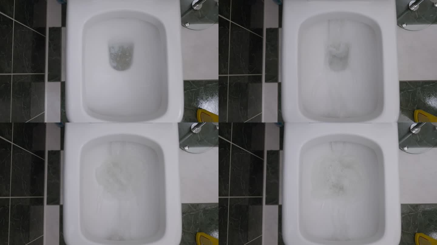 俯视图，水溅在马桶与洗涤剂。浴室室内清洁卫生五金特写。