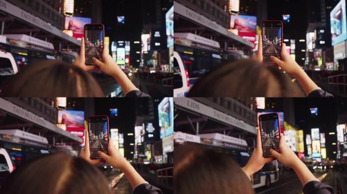 纽约时代广场，一位女士手持智能手机的手的细节