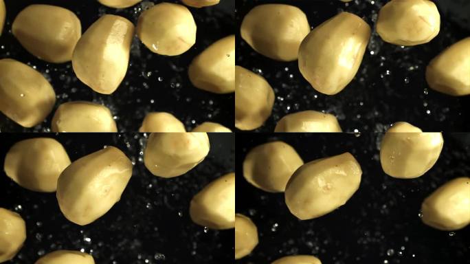 去皮的土豆飞起来了。从上面看。用高速摄像机拍摄，每秒1000帧。
