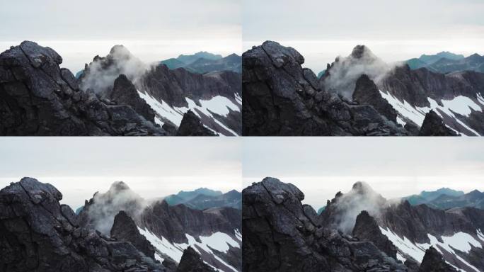 挪威Senja岛Kvaenan的峰顶云雾缭绕。静态的照片