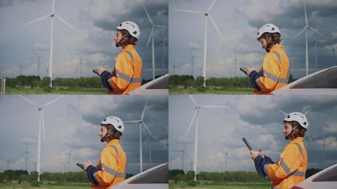 风力发电机女工程师在风力发电机电站使用平板电脑进行检查和诊断