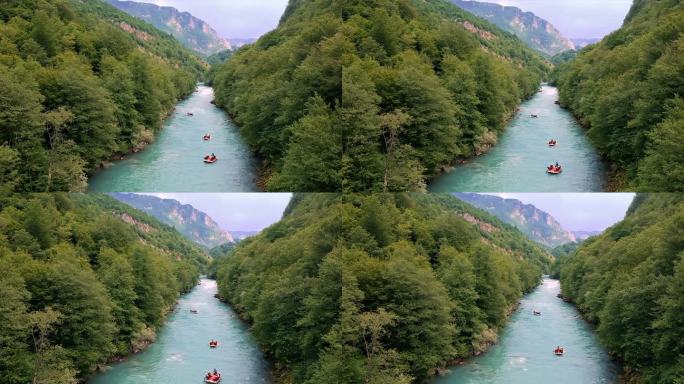 人们在三个充气木筏划水穿过山河-鸟瞰图
