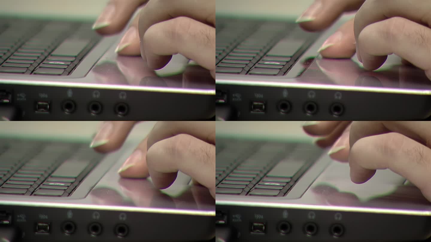 手提电脑触控板上的女人之手。关闭了。