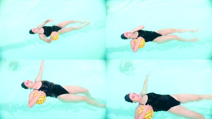水球训练:球员在仰泳和抛球的同时漂浮在她的背上