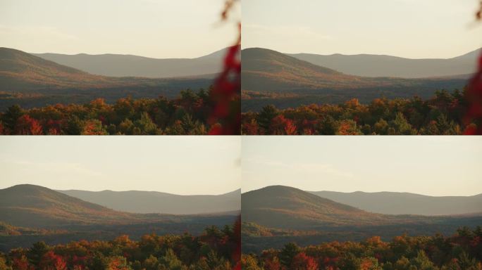 潘横跨在高峰期间，充满活力的红橙色起伏的丘陵一览无遗，白山NH
