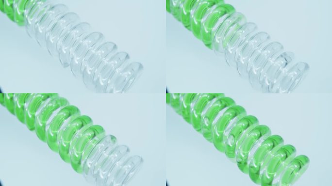 绿色的液体沿着玻璃螺旋管流动。