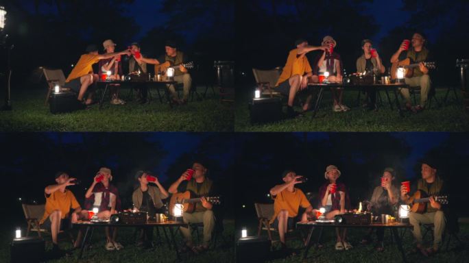 快乐的亚洲多元团体朋友一起喝啤酒。晚上在大自然中露营，他们感到放松和清爽。休闲旅行和户外活动的生活方