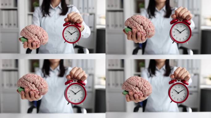 拿着红色闹钟和人工大脑模型的女人，4k慢动作电影