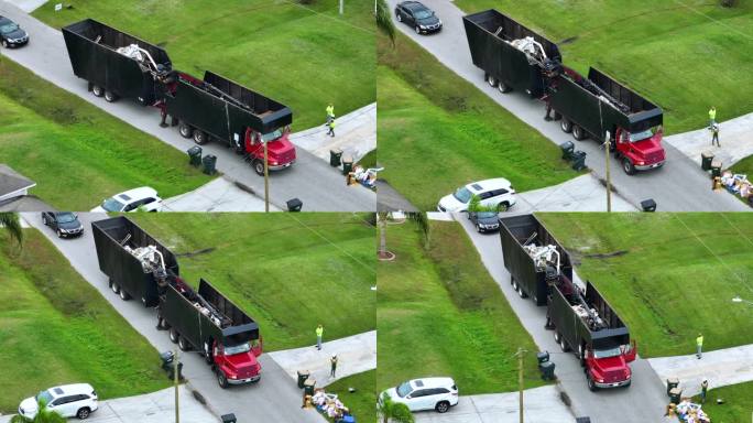 飓风伊恩横扫佛罗里达后，一辆特殊的灾后恢复自卸卡车在郊区街道上拾取植被残骸。处理自然灾害的后果