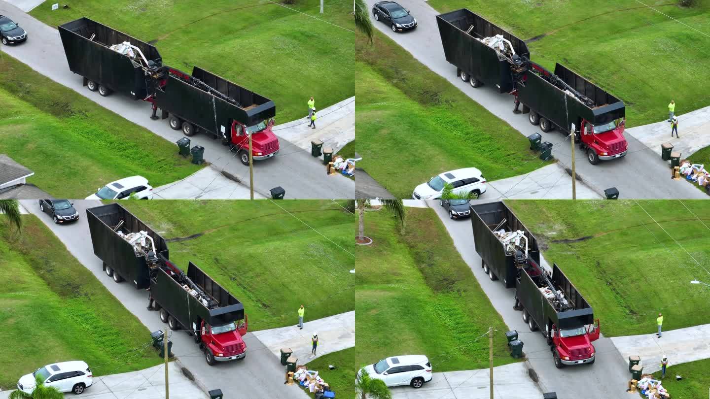 飓风伊恩横扫佛罗里达后，一辆特殊的灾后恢复自卸卡车在郊区街道上拾取植被残骸。处理自然灾害的后果