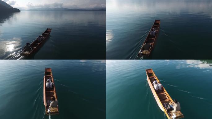 云南泸沽湖水上船游客近景航拍