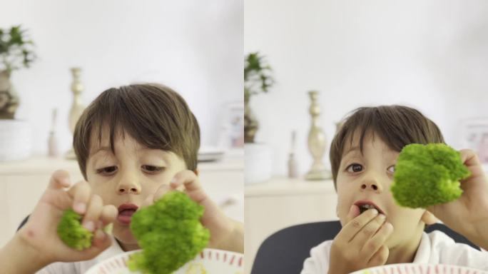 小孩用手吃花椰菜，不小心掉了一些在地板上，然后从桌子上站起来捡起来