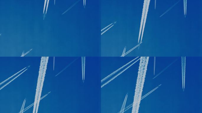 正下方的镜头是飞机在万里无云的蓝天上留下的水汽痕迹。在正下方，一张令人惊叹的照片捕捉到了飞机在万里无