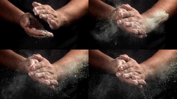 厨师用面粉拍打双手。用高速摄像机拍摄，每秒1000帧。