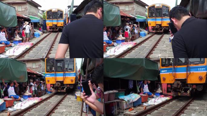 泰国曼谷美功铁路市场火车行驶而过