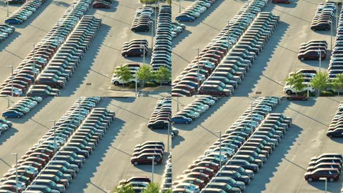 当地经销商的大型停车场，有许多全新的汽车停放出售。美国汽车工业的发展与整车概念的分布