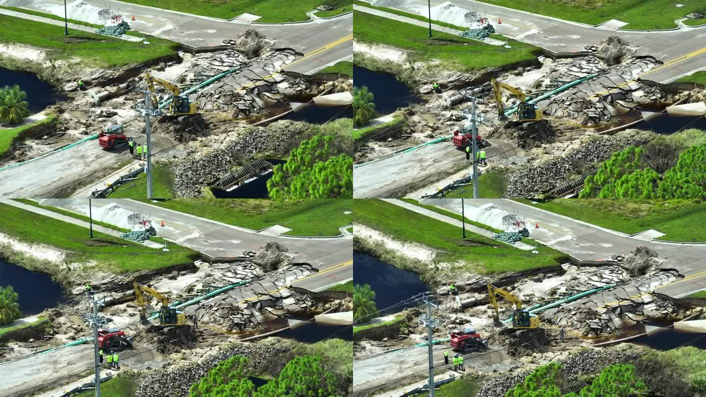 航拍图:洪水冲走沥青后被河水冲毁的公路桥重建图。重建被毁坏的交通基础设施