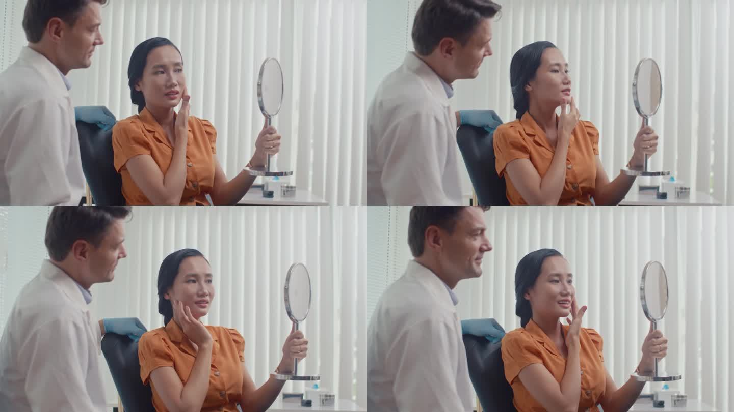 一位女士在做完美容手术后，坐在医生旁边看着镜子里的脸