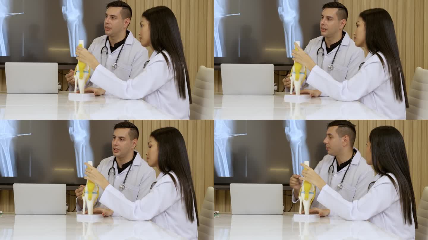 医生讨论病人膝关节的核磁共振扫描结果