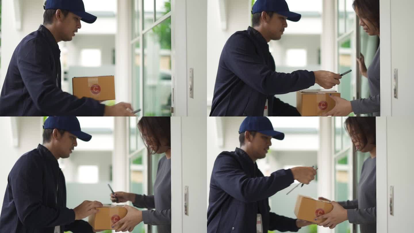 快递员将一个包裹送到客户手中，并在智能手机上签字接受。